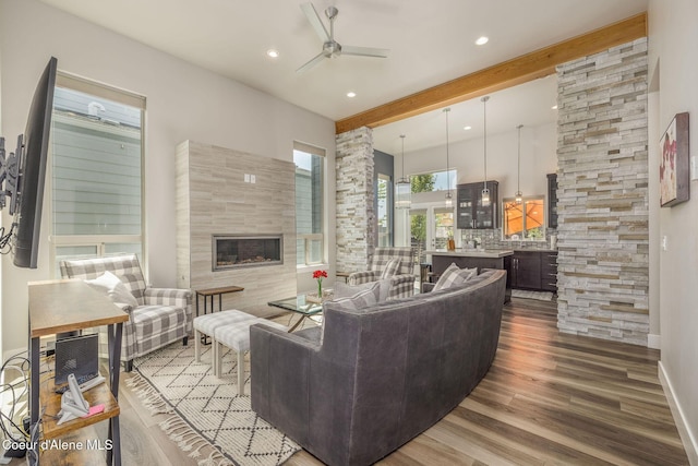 2999 N Casa Ct, Coeur Dalene, ID 83814 - living room with ceiling fan, wood finished floors, a tile fireplace, recessed lighting, and beam ceiling