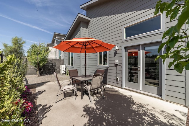 2999 N Casa Ct, Coeur Dalene, ID 83814 - view of patio with outdoor dining area and french doors
