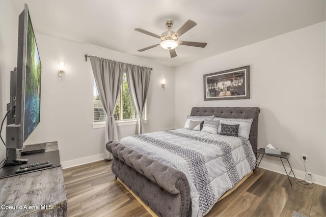 2999 N Casa Ct, Coeur Dalene, ID 83814 - bedroom with wood finished floors and a ceiling fan