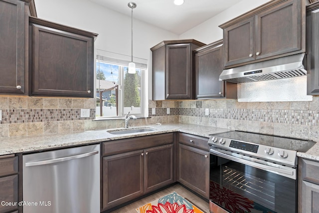 6522 N Idlewood Dr, Coeur Dalene, ID 83815 - kitchen featuring stainless steel appliances, extractor fan, dark brown cabinetry, and decorative backsplash