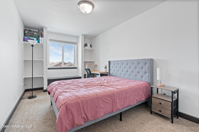 6522 N Idlewood Dr, Coeur Dalene, ID 83815 - carpeted bedroom with baseboards and a textured ceiling
