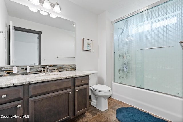 6522 N Idlewood Dr, Coeur Dalene, ID 83815 - bathroom featuring vanity, backsplash, and shower / bath combination with glass door
