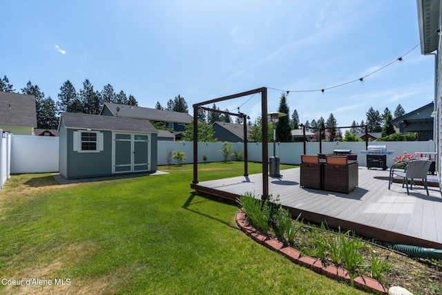 6522 N Idlewood Dr, Coeur Dalene, ID 83815 - fenced backyard with a storage shed, a deck, and outdoor dining area