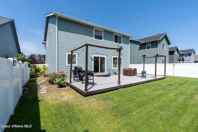 6522 N Idlewood Dr, Coeur Dalene, ID 83815 - rear view of house featuring a deck, a fenced backyard, a pergola, and an outdoor hangout area