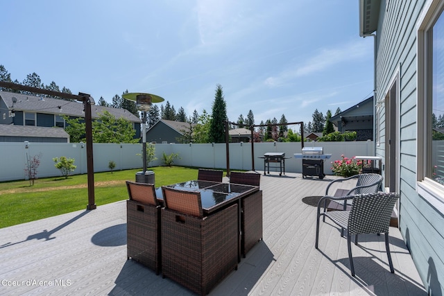 6522 N Idlewood Dr, Coeur Dalene, ID 83815 - fenced backyard featuring outdoor dining space and a wooden deck