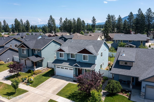 6522 N Idlewood Dr, Coeur Dalene, ID 83815 - aerial perspective of suburban area featuring a mountain backdrop