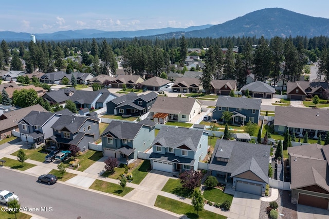 6522 N Idlewood Dr, Coeur Dalene, ID 83815 - aerial perspective of suburban area with a mountainous background