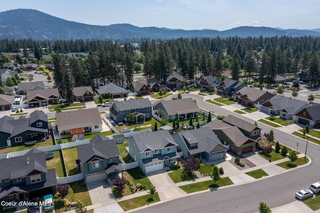 6522 N Idlewood Dr, Coeur Dalene, ID 83815 - aerial perspective of suburban area with a mountainous background
