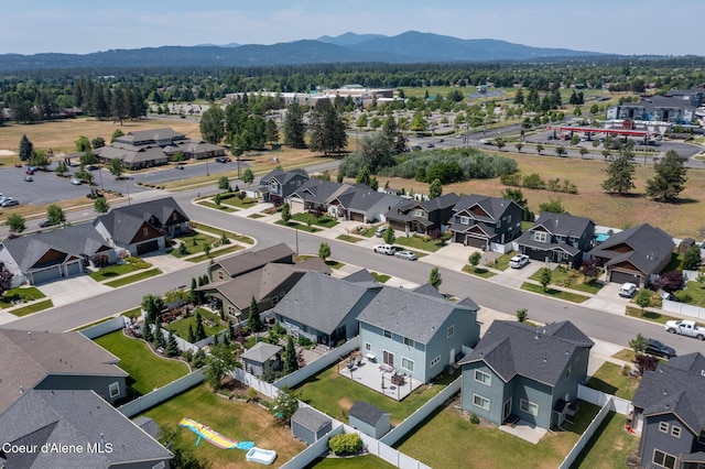6522 N Idlewood Dr, Coeur Dalene, ID 83815 - aerial perspective of suburban area featuring a mountainous background