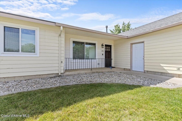 1601 N Summer Rose St, Post Falls, ID 83854 - doorway to property featuring a lawn and a porch