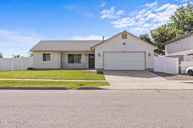 1601 N Summer Rose St, Post Falls, ID 83854 - view of front of property featuring a garage, concrete driveway, and a gate
