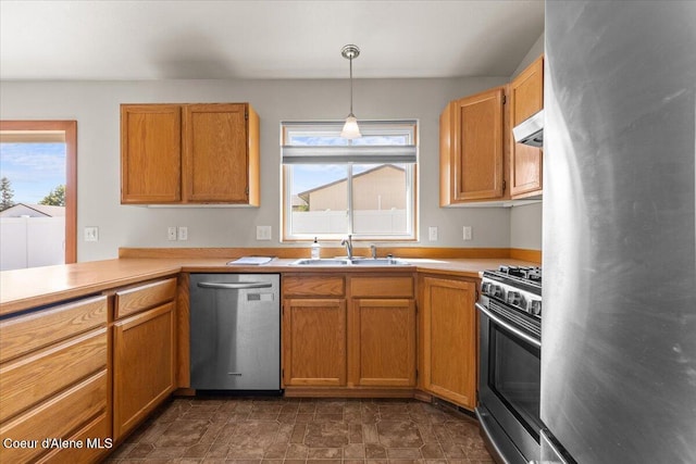 1601 N Summer Rose St, Post Falls, ID 83854 - kitchen featuring appliances with stainless steel finishes, range hood, healthy amount of natural light, and light countertops