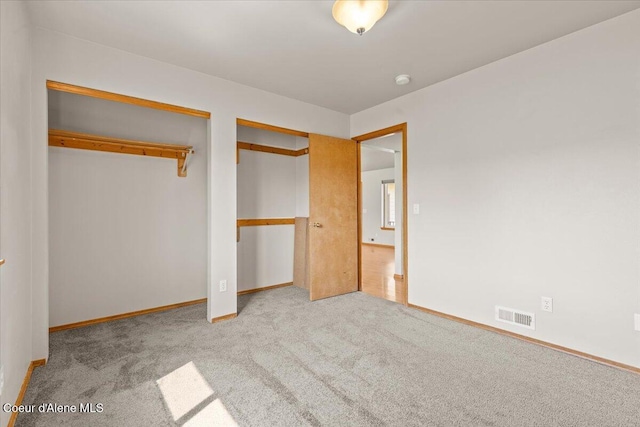 1601 N Summer Rose St, Post Falls, ID 83854 - unfurnished bedroom featuring carpet and multiple closets