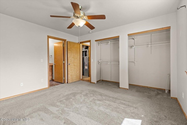 1601 N Summer Rose St, Post Falls, ID 83854 - unfurnished bedroom with multiple closets, carpet, and ceiling fan