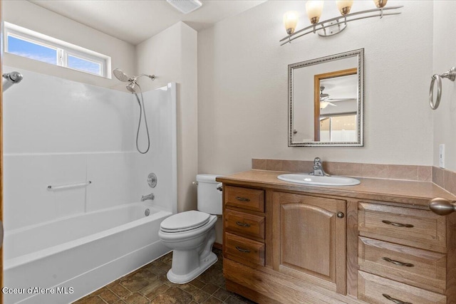 1601 N Summer Rose St, Post Falls, ID 83854 - full bathroom with vanity, shower / washtub combination, and stone finish floors