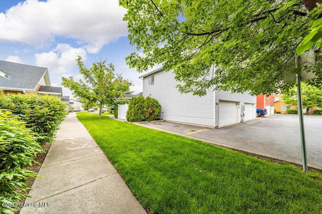 931 N Goldenrod Ct, Post Falls, ID 83854 - view of grassy yard with a garage