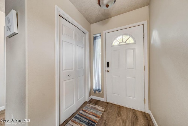 931 N Goldenrod Ct, Post Falls, ID 83854 - foyer entrance with wood finished floors and a textured ceiling