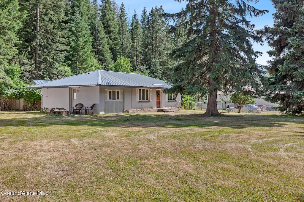 3840 E Nettleton Gulch Rd, Coeur Dalene, ID 83814 - rear view of house featuring a metal roof