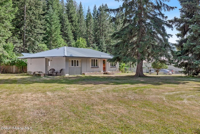 3840 E Nettleton Gulch Rd, Coeur Dalene, ID 83814 - rear view of house featuring a metal roof