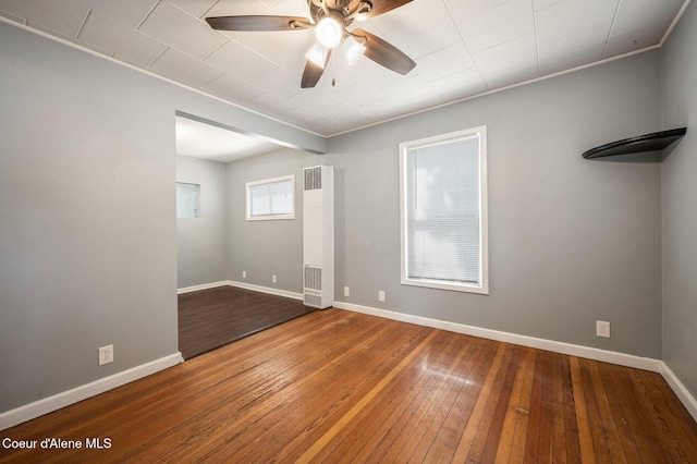 1412/1414 N 13th St, Coeur Dalene, ID 83814 - spare room featuring a heating unit, a ceiling fan, and wood-type flooring