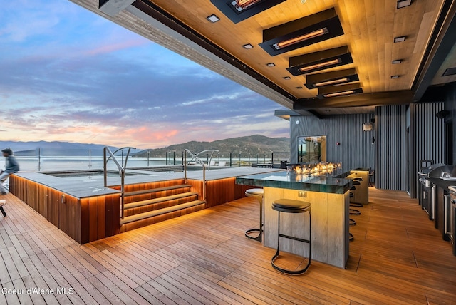 802 Sandpoint Ave # 8302, Sandpoint, ID 83864 - deck at dusk featuring a hot tub and a mountain view