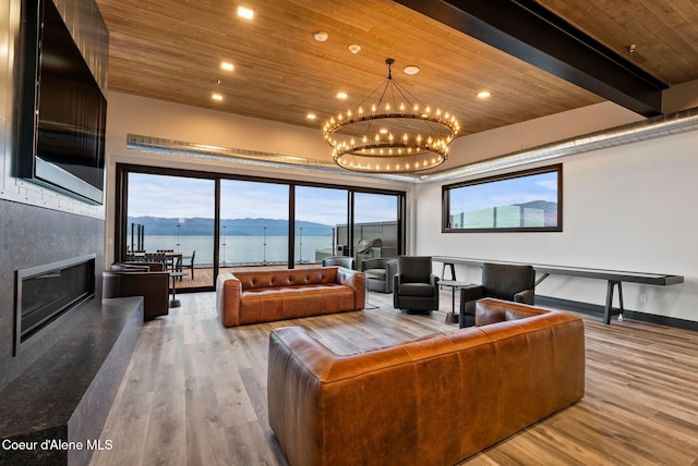 802 Sandpoint Ave # 8302, Sandpoint, ID 83864 - living room featuring a chandelier, wood ceiling, wood finished floors, recessed lighting, and a glass covered fireplace
