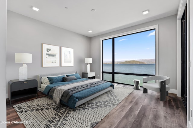 802 Sandpoint Ave # 8302, Sandpoint, ID 83864 - bedroom featuring wood finished floors and a water view
