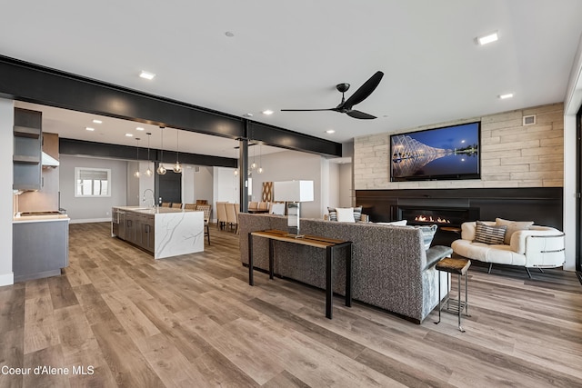 802 Sandpoint Ave # 8302, Sandpoint, ID 83864 - living room with ceiling fan, a glass covered fireplace, and light wood-style floors