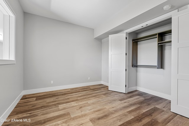 802 Sandpoint Ave # 8302, Sandpoint, ID 83864 - unfurnished bedroom featuring light wood-type flooring and a closet
