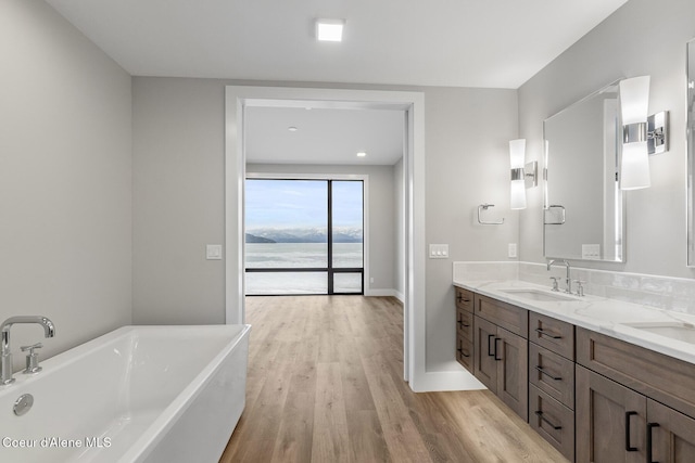 802 Sandpoint Ave # 8302, Sandpoint, ID 83864 - bathroom with a freestanding tub, double vanity, and wood finished floors
