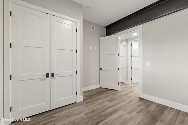 802 Sandpoint Ave # 8302, Sandpoint, ID 83864 - unfurnished bedroom featuring a closet and light wood finished floors