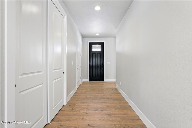 3510 N Cyprus Fox Loop, Post Falls, ID 83854 - doorway to outside with wood finished floors and recessed lighting