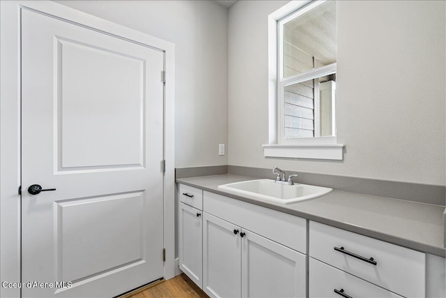 3510 N Cyprus Fox Loop, Post Falls, ID 83854 - kitchen featuring white cabinets and light wood-style flooring