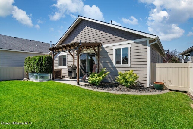 7934 W Kayak Ct, Rathdrum, ID 83858 - back of house with a pergola and a patio