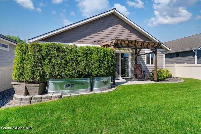 7934 W Kayak Ct, Rathdrum, ID 83858 - back of property with a pergola and a patio