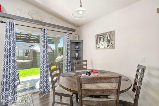 7934 W Kayak Ct, Rathdrum, ID 83858 - dining area featuring vaulted ceiling and wood finished floors
