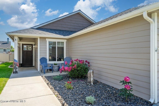 7934 W Kayak Ct, Rathdrum, ID 83858 - property entrance with a shingled roof