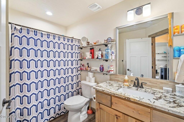 7934 W Kayak Ct, Rathdrum, ID 83858 - bathroom featuring vanity, wood finished floors, and curtained shower