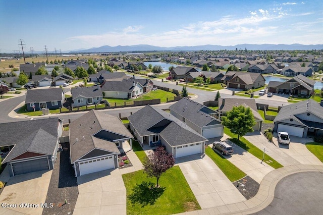 7934 W Kayak Ct, Rathdrum, ID 83858 - aerial view of residential area featuring a mountain backdrop