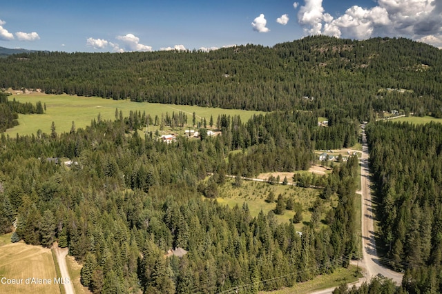 12 Otts Basin Rd, Sagle, ID 83860 - aerial view of property and surrounding area featuring a forest and a mountainous background