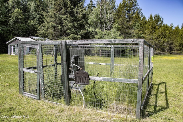 12 Otts Basin Rd, Sagle, ID 83860 - gate featuring a yard, exterior structure, and an outdoor structure