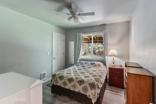 12 Otts Basin Rd, Sagle, ID 83860 - bedroom featuring wood finished floors and a ceiling fan