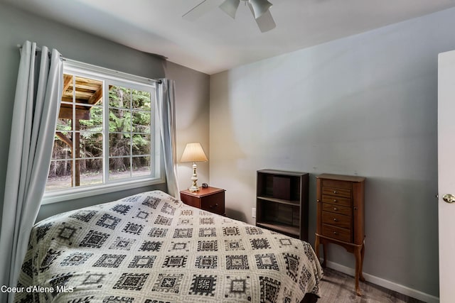 12 Otts Basin Rd, Sagle, ID 83860 - bedroom featuring a ceiling fan and wood finished floors