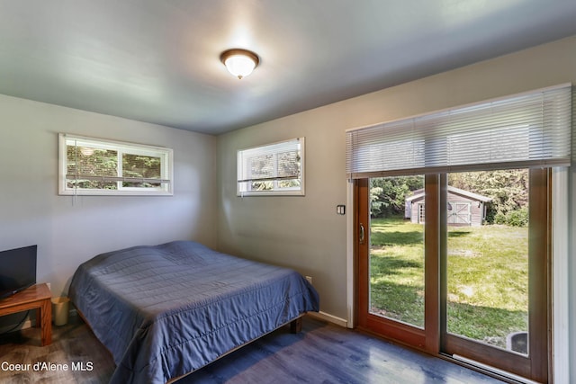 12 Otts Basin Rd, Sagle, ID 83860 - bedroom with multiple windows and wood finished floors