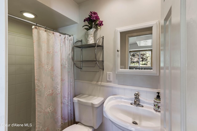 12 Otts Basin Rd, Sagle, ID 83860 - bathroom with a wainscoted wall and curtained shower