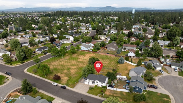 2442 N Rawhide Ridge Rd, Post Falls, ID 83854 - aerial overview of property's location with mountains and nearby suburban area