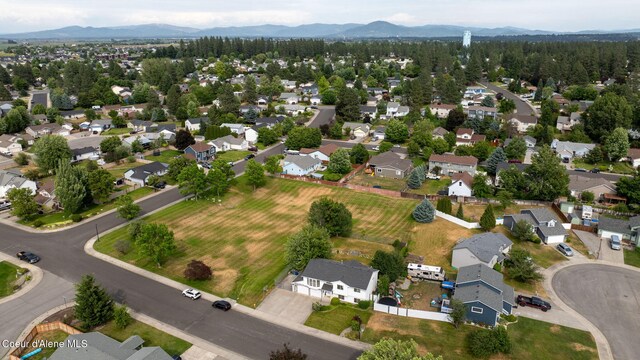 2442 N Rawhide Ridge Rd, Post Falls, ID 83854 - aerial view of property and surrounding area with a mountain backdrop and nearby suburban area
