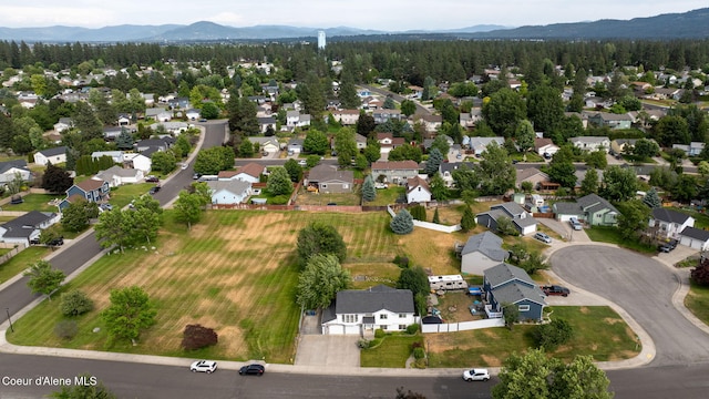 2442 N Rawhide Ridge Rd, Post Falls, ID 83854 - aerial view of property and surrounding area with mountains and nearby suburban area