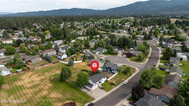 2442 N Rawhide Ridge Rd, Post Falls, ID 83854 - aerial view of property's location with mountains and nearby suburban area