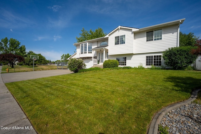 2442 N Rawhide Ridge Rd, Post Falls, ID 83854 - bi-level home with a front lawn and concrete driveway